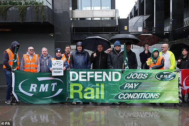 Dissatisfaction is growing in democratic societies. Pictured: Railway workers on strike in Britain on March 18