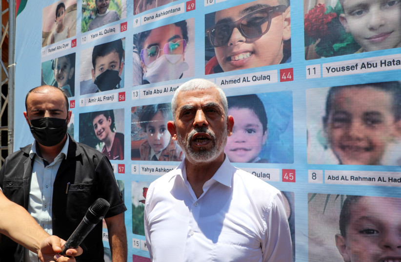 Hamas leader Yehya Al-Sinwar speaks to the media following a meeting with U.N. mediators, in Gaza City June 21, 2021. (credit: REUTERS/MOHAMMED SALEM)