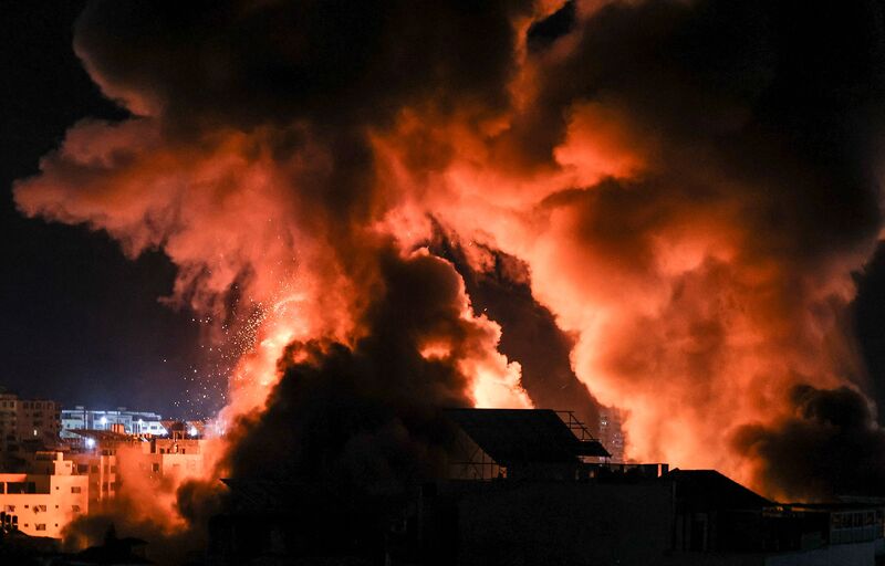 Explosions above buildings in Gaza City.