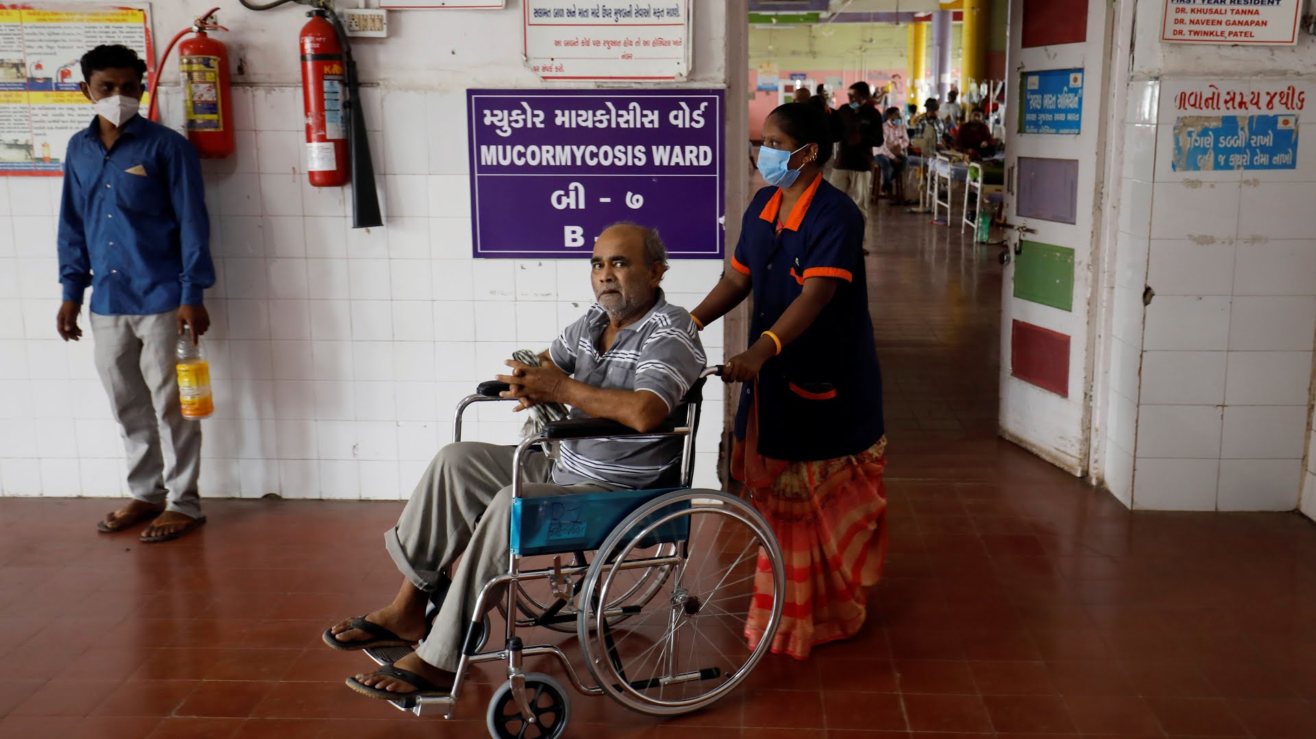Bhikhabhai Jivrajbhai Jethwa, who was suffering from Mucormycosis, leaves hospital after he was discharged following his mouth surgery, in Ahmedabad