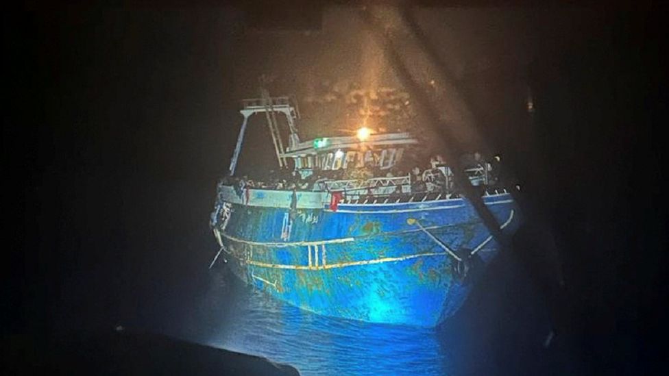 The boat under search lights