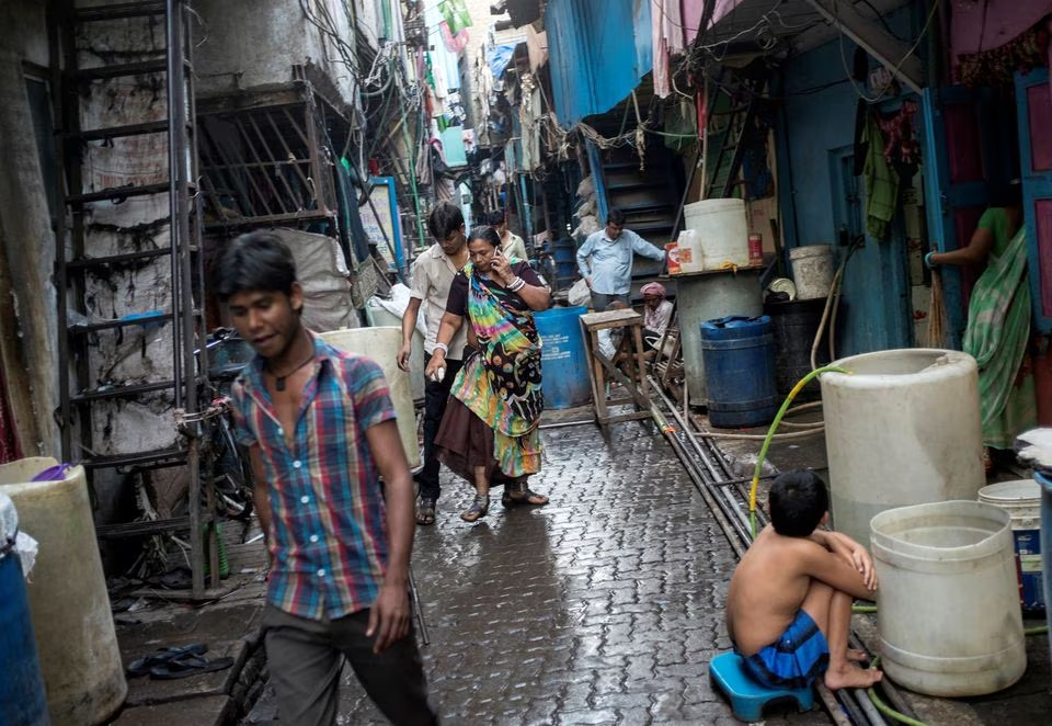 residents walk in an alley in dharavi one of asia s largest slums in mumbai march 12 2015 photo reuters file
