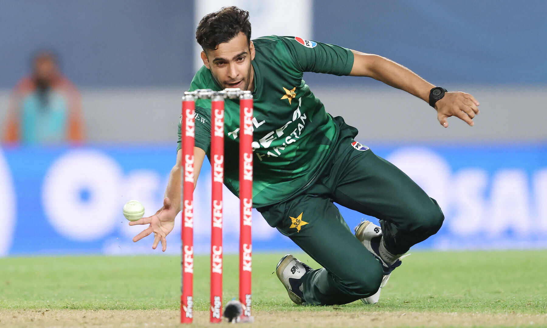 Abbas Afridi fields off his own bowling during the third T20I cricket match between New Zealand and Pakistan at Eden Park in Auckland on March 21, 2025. — AFP