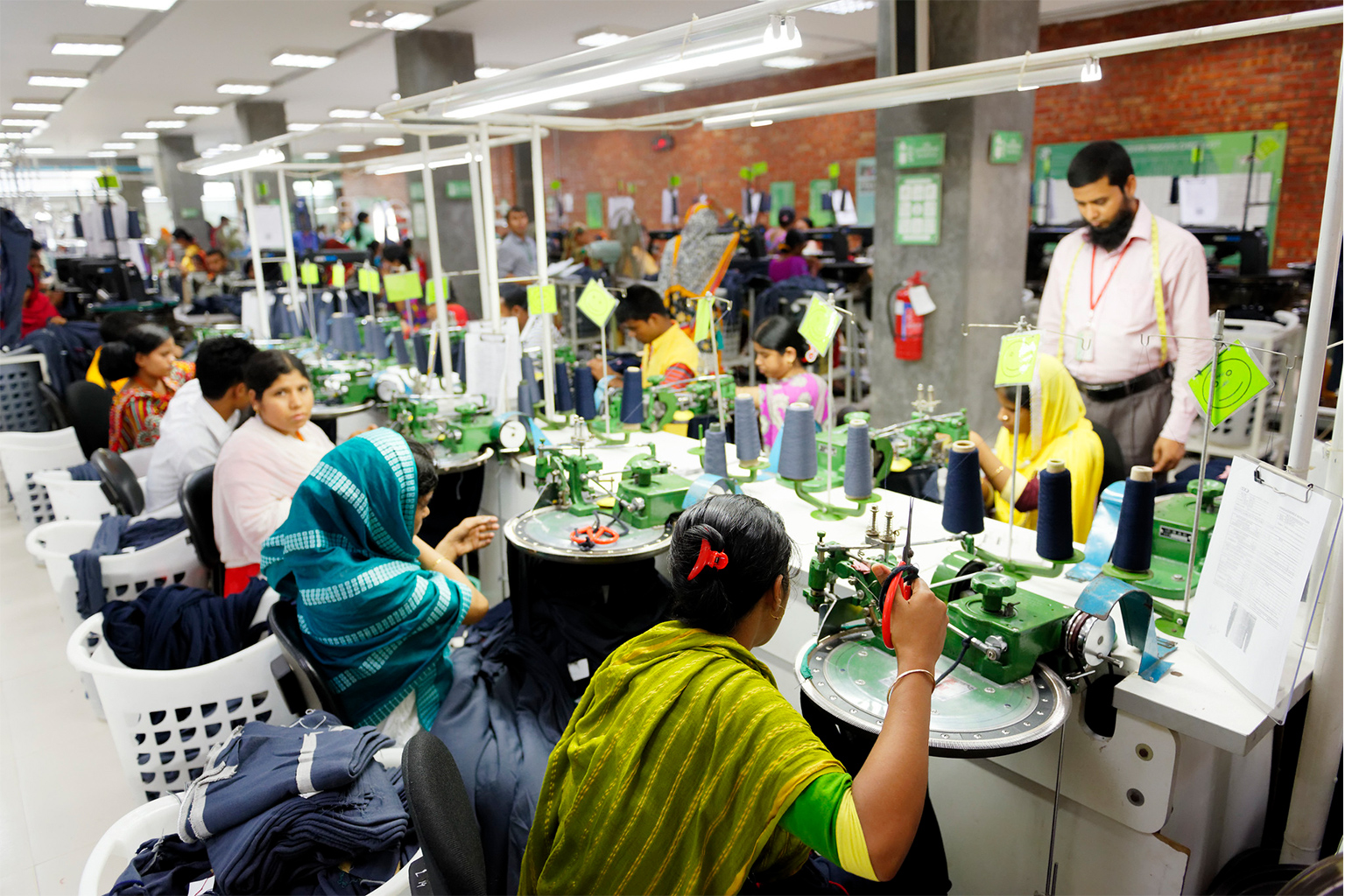 Workers and supervisors are seen working side by side in one of Bangladesh's exporting garment factories. 