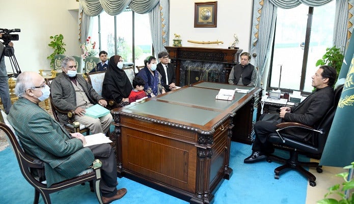 prime minister imran khan pictured during a meeting with the family of missing journalist mudassar naaru in islamabad on dec 9 2021 photo twitter shireenmazari1