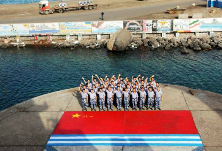 Chinese soldiers are seen in front of a PLA flag at the force's base in Djibouti. Photo: PLA Daily 