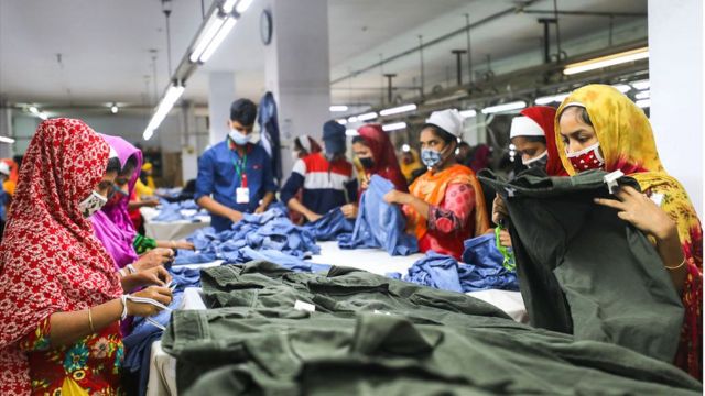 workers check jeans in a Bangladeshi factory