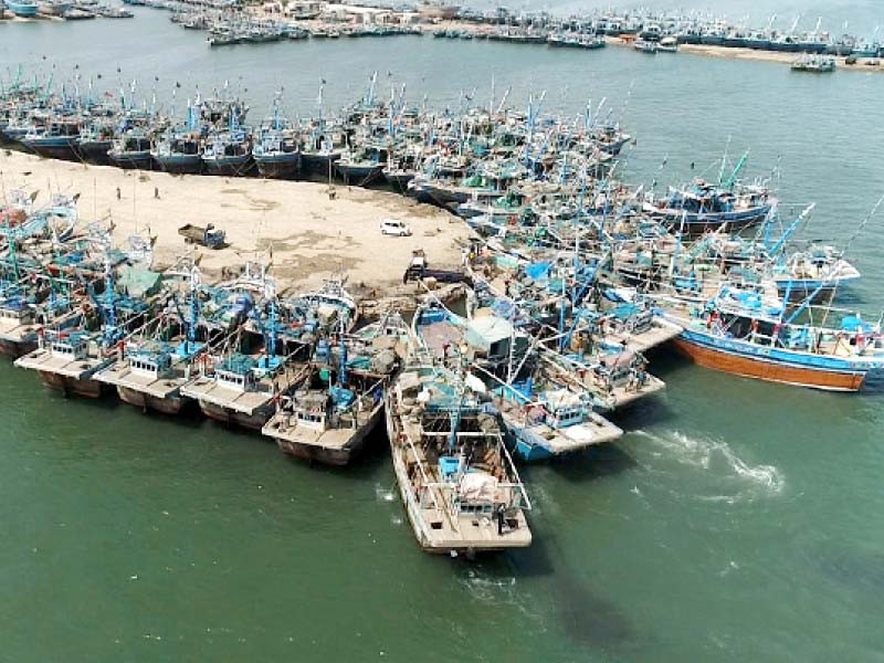 fishing boats are anchored at the ibrahim hyderi jetty due to the cyclone warning in the coastal areas of sindh and balochi stan photo express