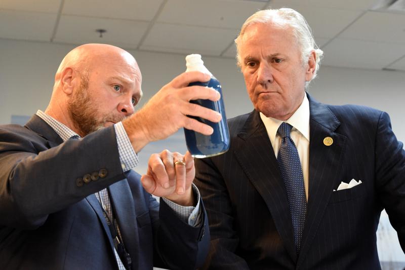 South Carolina Gov. Henry McMaster, right, listens as Foster Jordan of Charles River Labs, left, talks about the properties of horseshoe crab blood, which is a vital component in the contamination testing of injectable medicines - including the coronavirus vaccines - at Charles River Labs on Friday, Aug. 6, 2021, in Charleston, S.C. McMaster says the South Carolina company that bleeds horseshoe crabs for a component crucial to contamination testing of injectable medications is vital to development of a domestic medical supply chain. (AP Photo/Meg Kinnard)