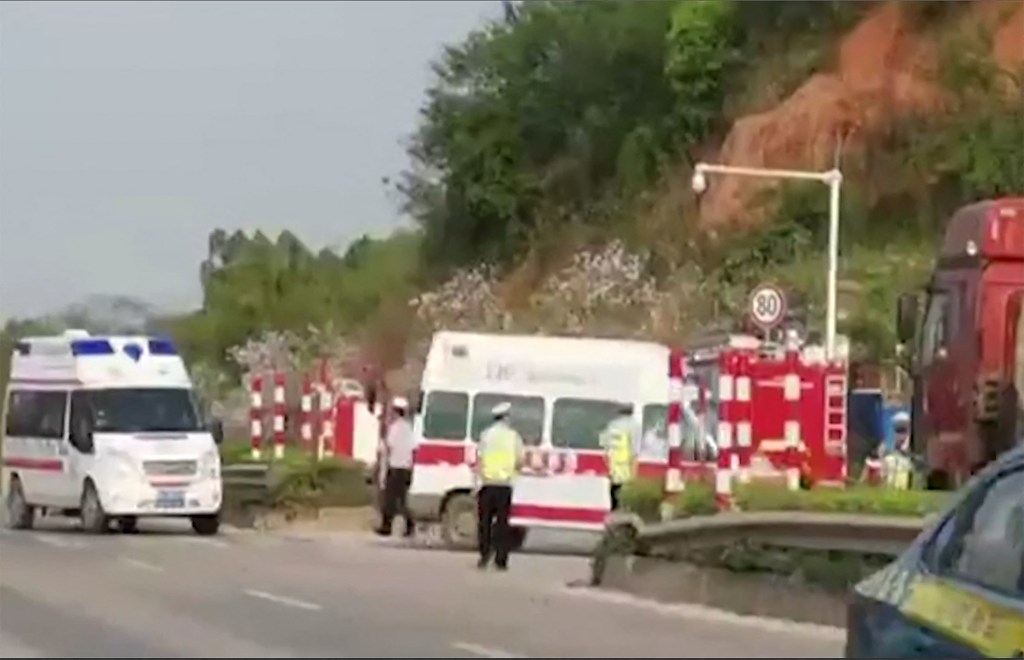 Ambulances arrive at the scene after a China Eastern plane reportedly crashed in Teng County in Wuzhou City, Guangxi province.