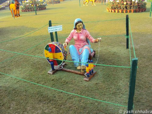 Statue-of-a-woman-playing-Spinning-Wheel-Terraced-Garden.jpg