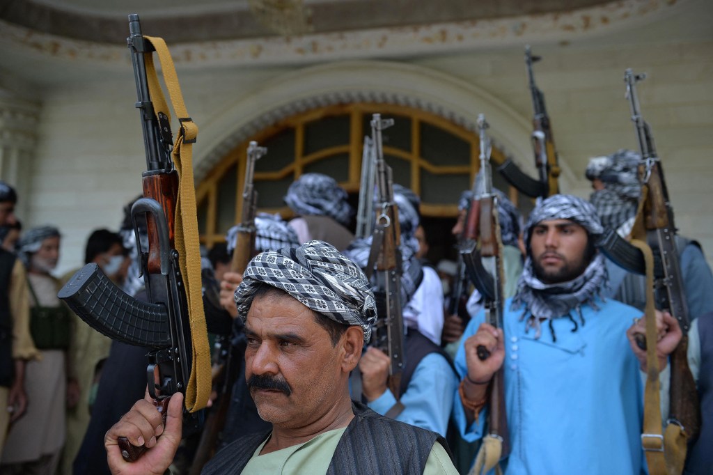 Afghan militia gather with their weapons to support Afghanistan's security forces against the Taliban. 