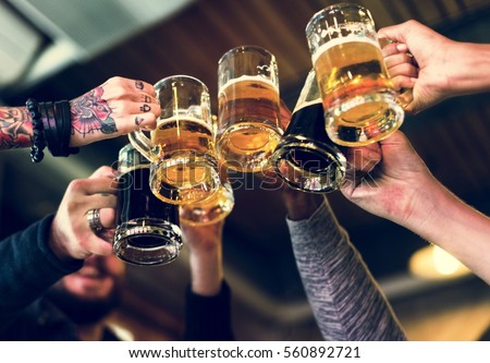 stock-photo-hands-hold-beverage-beers-bottle-cheers-560892721.jpg