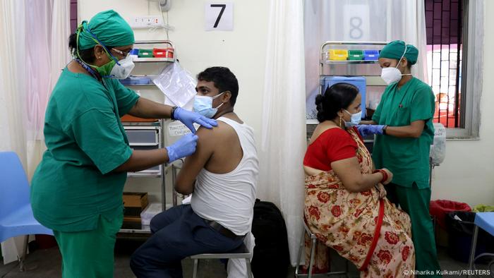 Rohit Gupta, 27 and Nandani Gupta, 42, receive their first dose of COVISHIELD