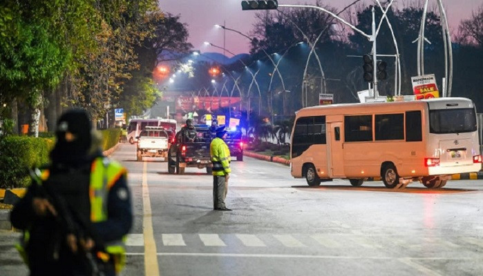 a convoy carrying the australian team is flanked by heavy security in islamabad afp