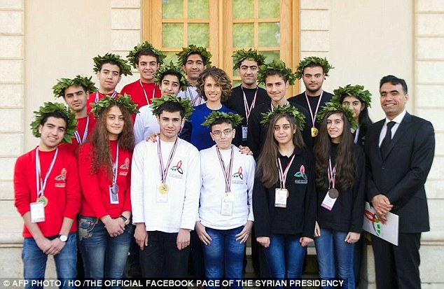 24E2114800000578-2919196-Asma_al_Assad_C_posing_for_a_group_picture_with_the_winners_of_t-a-20_1421801434089.jpg