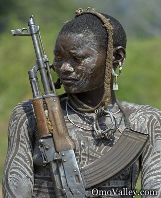 A%20member%20of%20the%20Mursi%20tribe%20with%20an%20AK%2047%20rifle.jpg