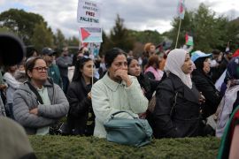 A woman reacts as speakers discuss the situation in Palestine during a rally held in support of Palestinians amid the ongoing conflict between Israel and the Palestinian Islamist group Hamas, in Mineola, New York, U.S., October 15, 2023