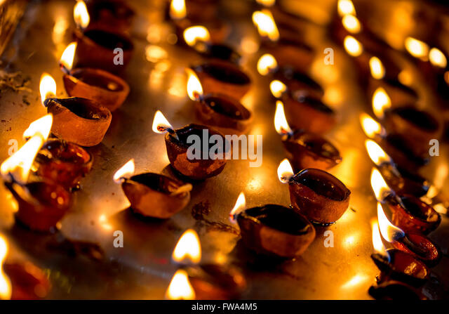 burning-candles-in-the-indian-temple-diwali-the-festival-of-lights-fwa4m5.jpg