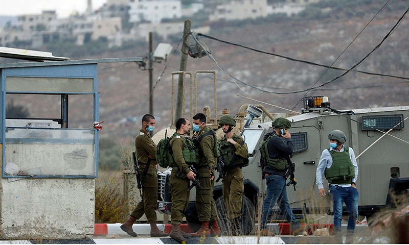 Members of Israeli forces gather at the scene of an incident at the Hawara checkpoint near the Palestinian city of Nablus, in the Israeli-occupied West Bank November 4, 2020. — Reuters