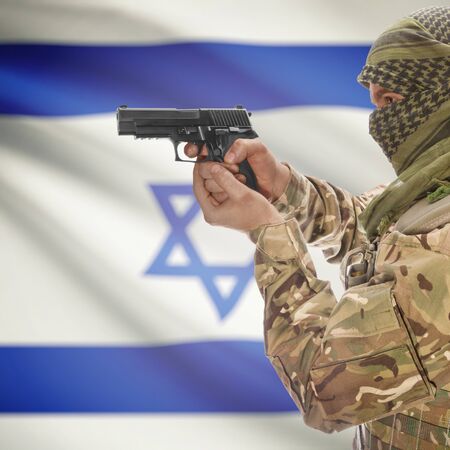 50755467-man-with-gun-in-hand-and-national-flag-on-background-series--israel.jpg