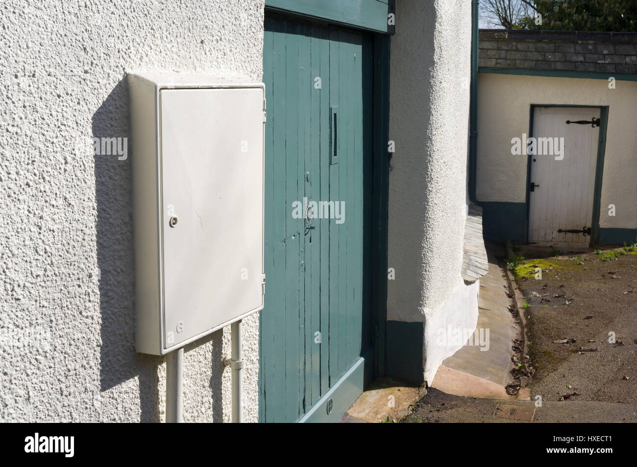 white-electricity-box-on-the-wall-of-a-house-HXECT1.jpg