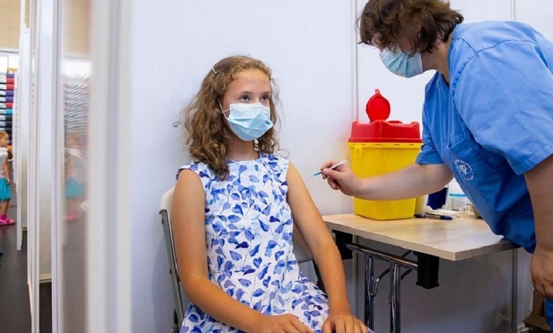 This file photo shows a 13-year-old girl receiving a Covid-19 vaccine in Estonia. —AP