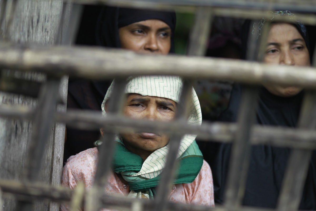 rohingya-muslim-women-look-out-their-home-aung-mingalar-quarter-sittwe.jpg