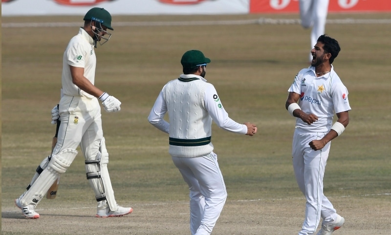 Pakistan's Hasan Ali (R) celebrates after taking the wicket of South Africa's Aiden Markram (L) during the fifth and final day of the second Test cricket match at the Rawalpindi Cricket Stadium on Feb 8. —  AFP