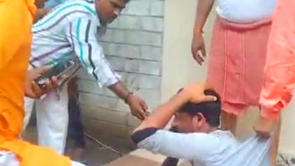 A screen grab of the viral video showing a bangle-seller being assaulted in Indore
