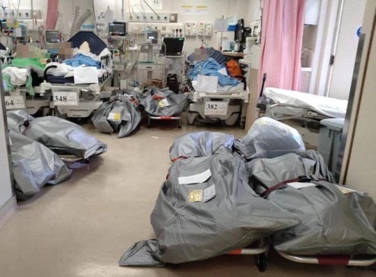 Bodies piled up next to patients in Hong Kong hospital during fifth wave of COVID Hong Kong Hospital Authority urges understanding as shocking photo emerges of bodies stored on ward The photo, circulating on Facebook on Friday, showed six body bags left on stretchers next to three patients on a public hospital ward. The photo was taken at the Accident & Emergency ward of Queen Elizabeth Hospital in Jordan, a medic who work at the hospital told HKFP. They spoke on condition of anonymity. They indicated that the photo would have been taken around early March, although the situation has largely been alleviated after workers sped up transfers to mortuaries. The hospital has also allocated an empty ward for temporary storage. https://hongkongfp.com/2022/03/11/covid-19-hong-kong-hospital-authority-urges-understanding-as-shocking-photo-emerges-of-bodies-stored-on-ward/