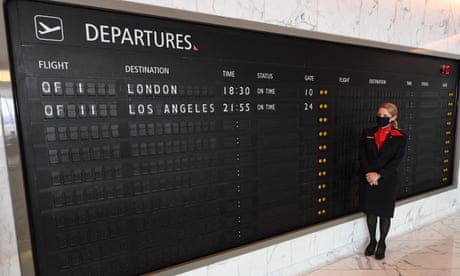 Qantas Prepares For Resumption Of International Travel In NSW Ahead Of COVID-19 Border Restrictions Lifting<br>SYDNEY, AUSTRALIA - OCTOBER 28: A Qantas staff member in the First Class lounge next to the departures board for next weeks flights during a media preview at Kingsford Smith International airport on October 28, 2021 in Sydney, Australia. Australia's international borders will reopen from Monday November 1, with fully vaccinated international arrivals able to travel into New South Wales and Victoria without needing to quarantine. Australian citizens will also be able to freely travel overseas from 1 November without requiring an exemption from the federal government and Border Force. (Photo by James D. Morgan/Getty Images)