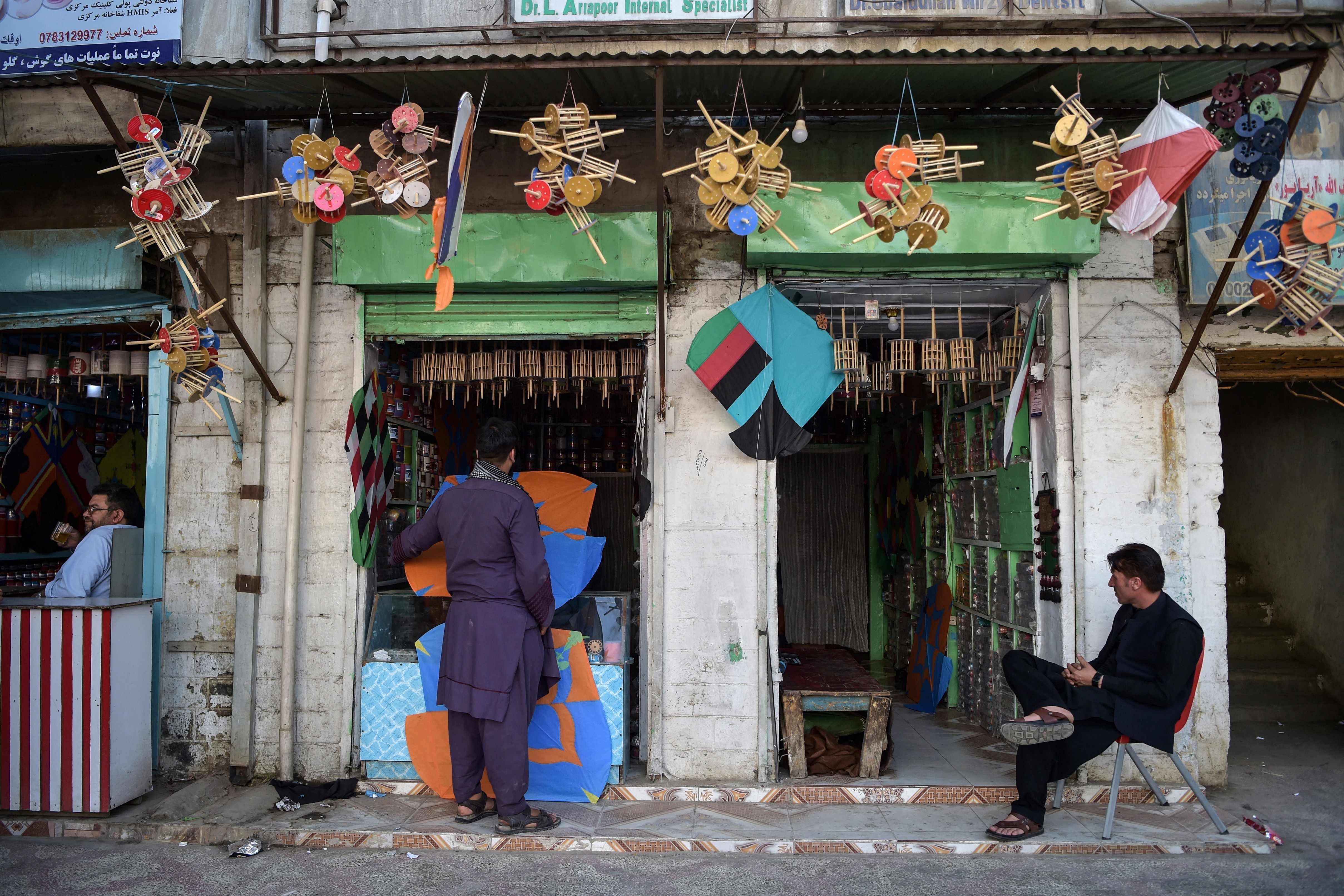 Kite vendors wait for customers at a shop in Shor Bazaar in the old quarters of Kabul