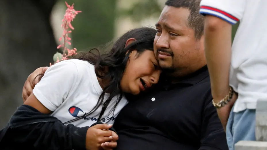 People react outside the Sgt Willie de Leon Civic Center, where students had been transported from Robb Elementary School after a shooting, in Uvalde, Texas, May 24, 2022.