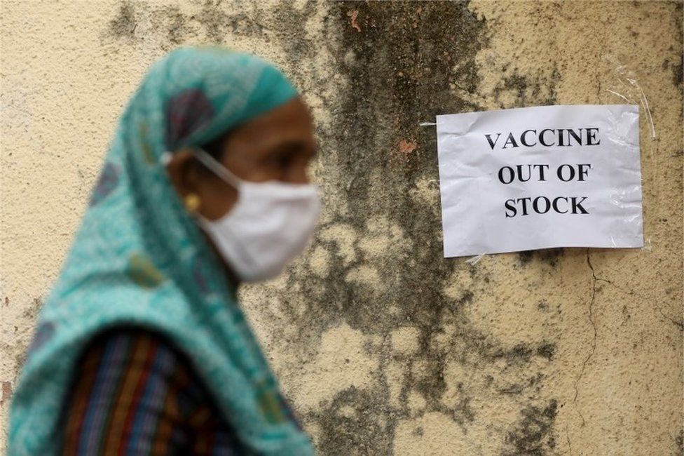 A notice about the shortage of coronavirus disease (COVID-19) vaccine supplies is seen at a vaccination centre, in Mumbai, India, April 8, 2021.