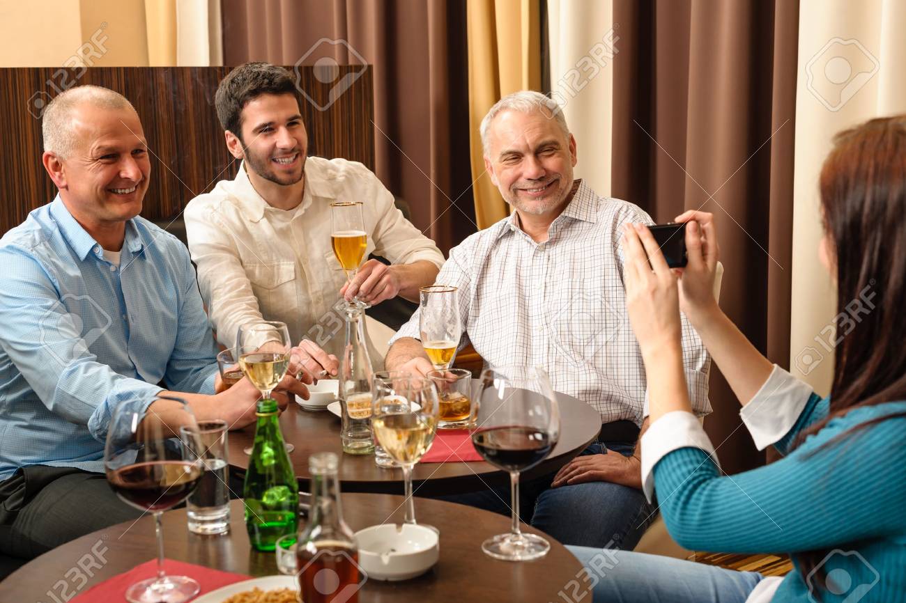 13166043-Business-people-having-drink-after-work-taking-picture-of-themselves-Stock-Photo.jpg