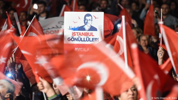 Supporters of Istanbul mayor Ekrem Imamoglu cheer as they protest the rerun of Istanbul election ordered by Turkey's election commission