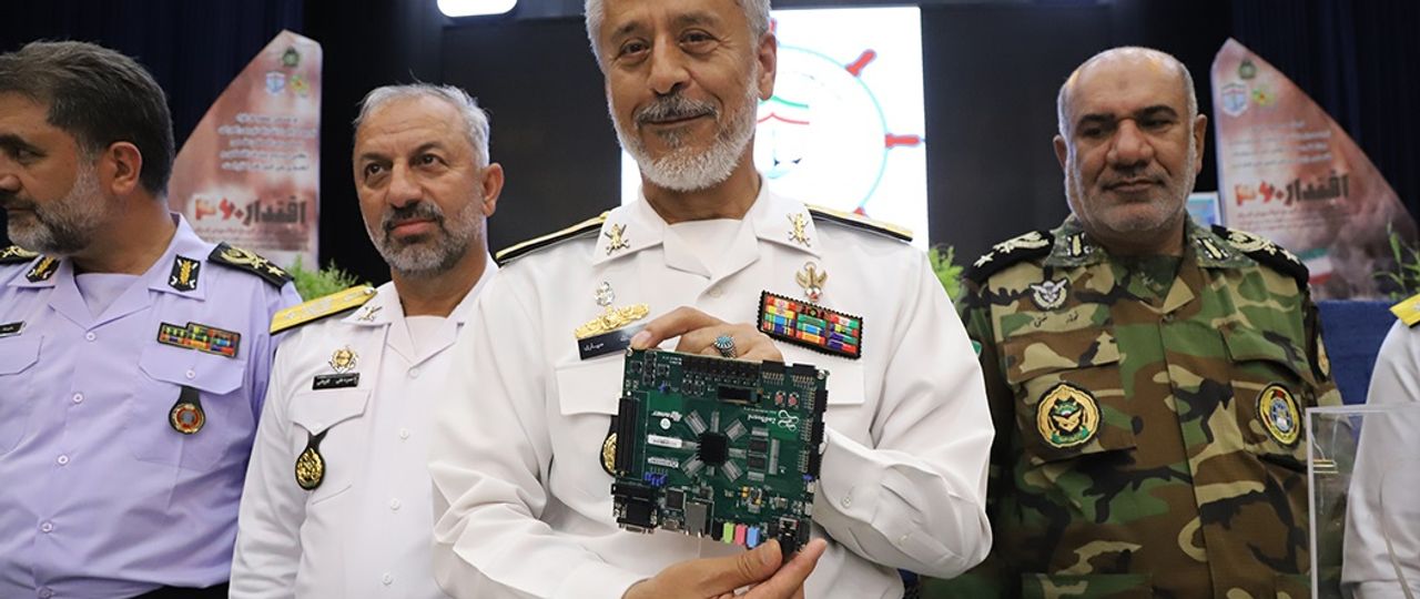 Rear Admiral Habibollah Sayyari, the Coordinating Deputy of the Islamic Republic’s Army, holding a so-called ‘quantum processor’ during a ceremony at the Navy’s Imam Khomeini Maritime University in Noshahr, in the northern province of Mazandaran on June 1, 2023 