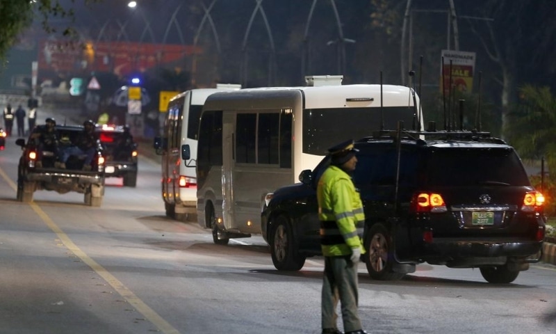 A special unit of Pakistani security forces escort a convoy of vehicles carrying the Australian cricket team toward a hotel upon their arrival in Islamabad on Sunday. — AP