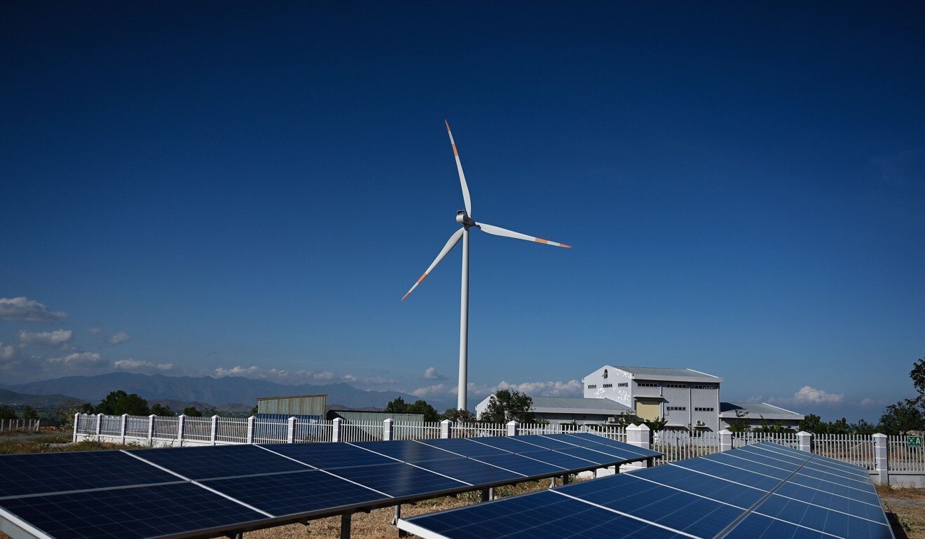 Solar panels and a wind turbine at the Phu Lac wind farm in southern Vietnam's Binh Thuan province. Photo: AFP