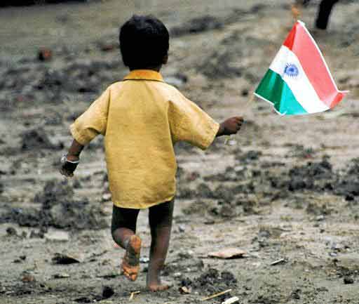 a-homeless-young-boy-waves-the-indian-flag.jpg