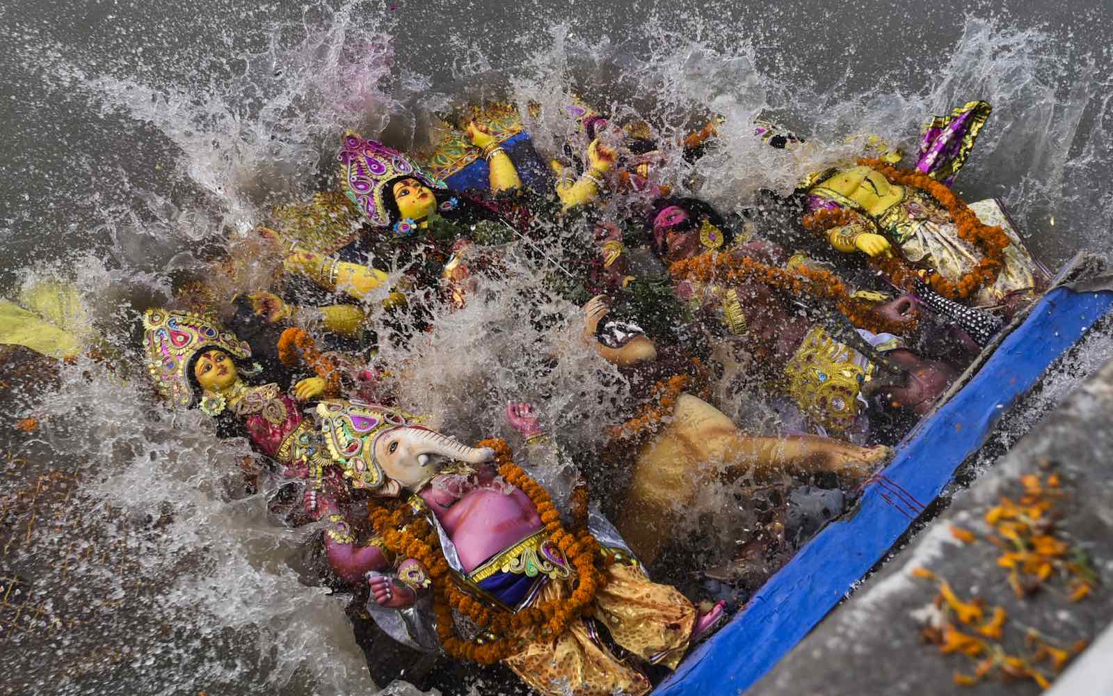 An idol of Goddess Durga immersed in the Brahmaputra River at the end of the Durga Puja festival in Guwahati, Assam, India, October 2018 (David Talukdar/NurPhoto via Getty Images)