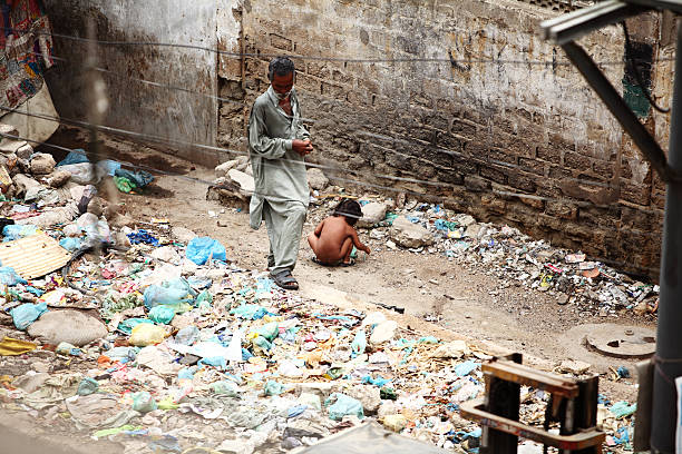 little-girl-defecation-in-open-by-the-roadside-garbage-dump.jpg