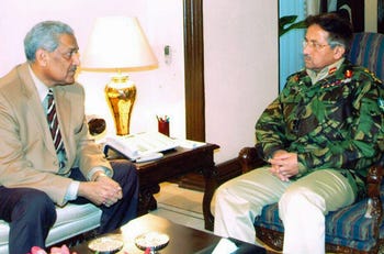 Pakistan President General Pervez Musharraf Abdul Qadeer Khan, in Islamabad, February 4, 2004. Shortly after, Khan appeared on state TV to confess and apologize for leaking nuclear secrets to other countries, while absolving the government of any responsibility