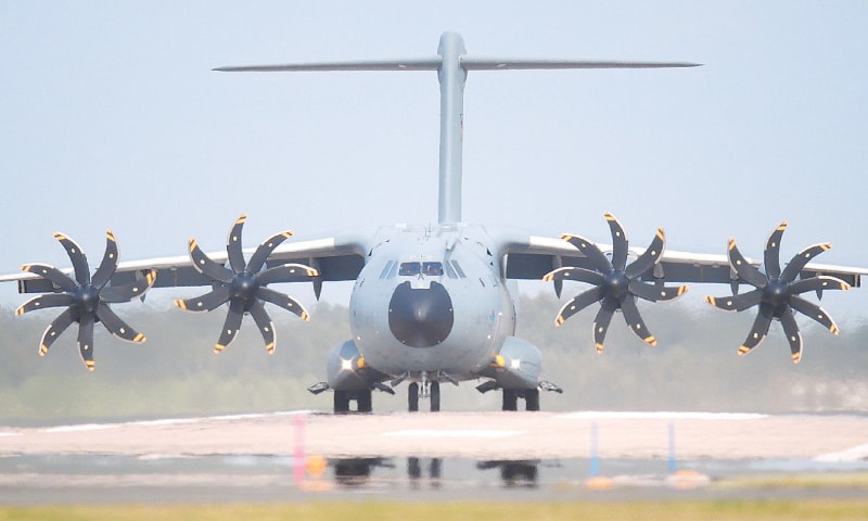 HANOVER: A transport aircraft of Bundeswehr, the German air force, taxis across the runway at an air base. The Bundeswehr plans to begin evacuating German citizens from Kabul on Monday.—AP