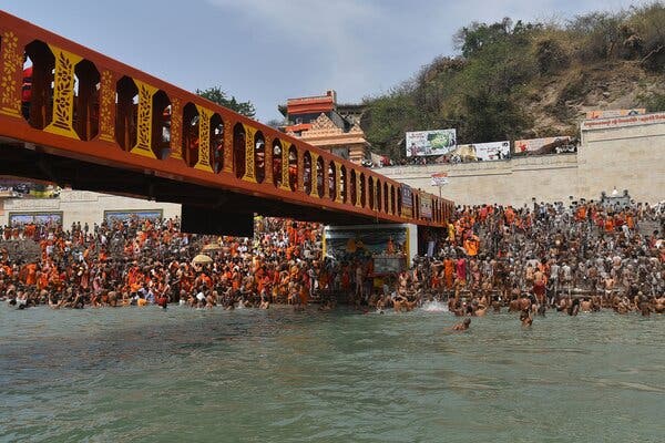 Pilgrims on a bank of the Ganges in Haridwar in April.
