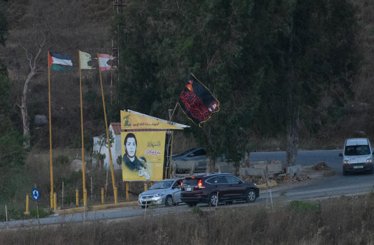  The Hezbollah flag and the Palestinian flag near the border between Lebanon and northern Israel. July 19, 2023 (credit: AYAL MARGOLIN/FLASH90)
