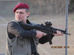 Zaid-Zaman-Hamid-firing-a-rifle-250x187.jpg