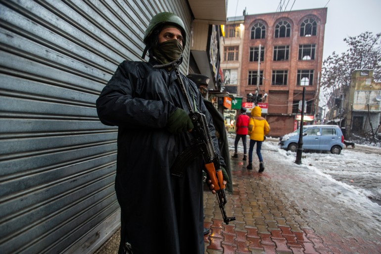 Indian paramilitary soldiers stand guard in Srinagar, Indian controlled Kashmir