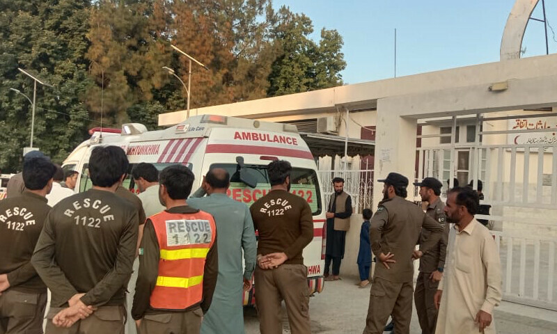 <p>This photo shows rescue workers surrounding an ambulance carrying Momand blast victims outside District Headquarters Hospital, Bajaur.— Photo by author</p>